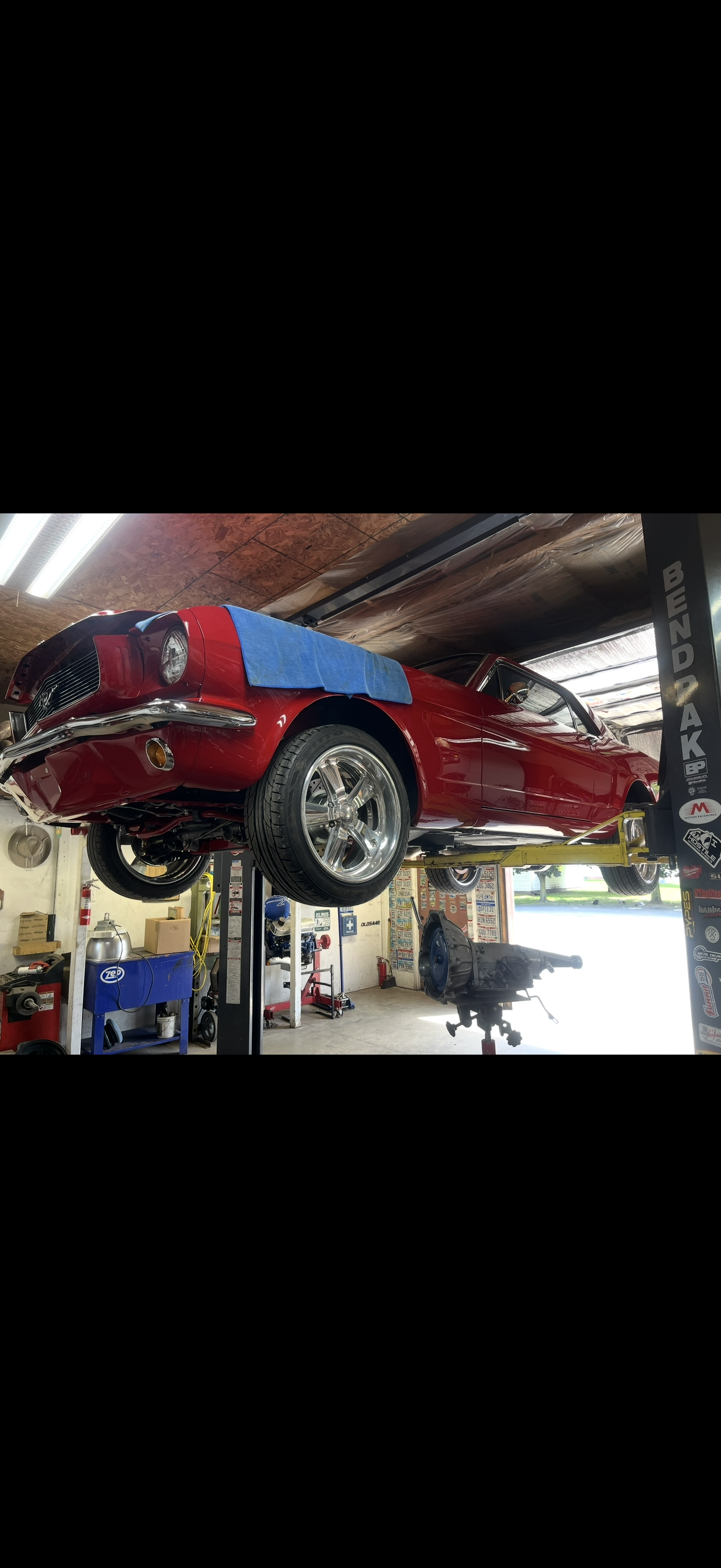 Steve's classic Ford Mustang on the lift at Real Deal Automotive